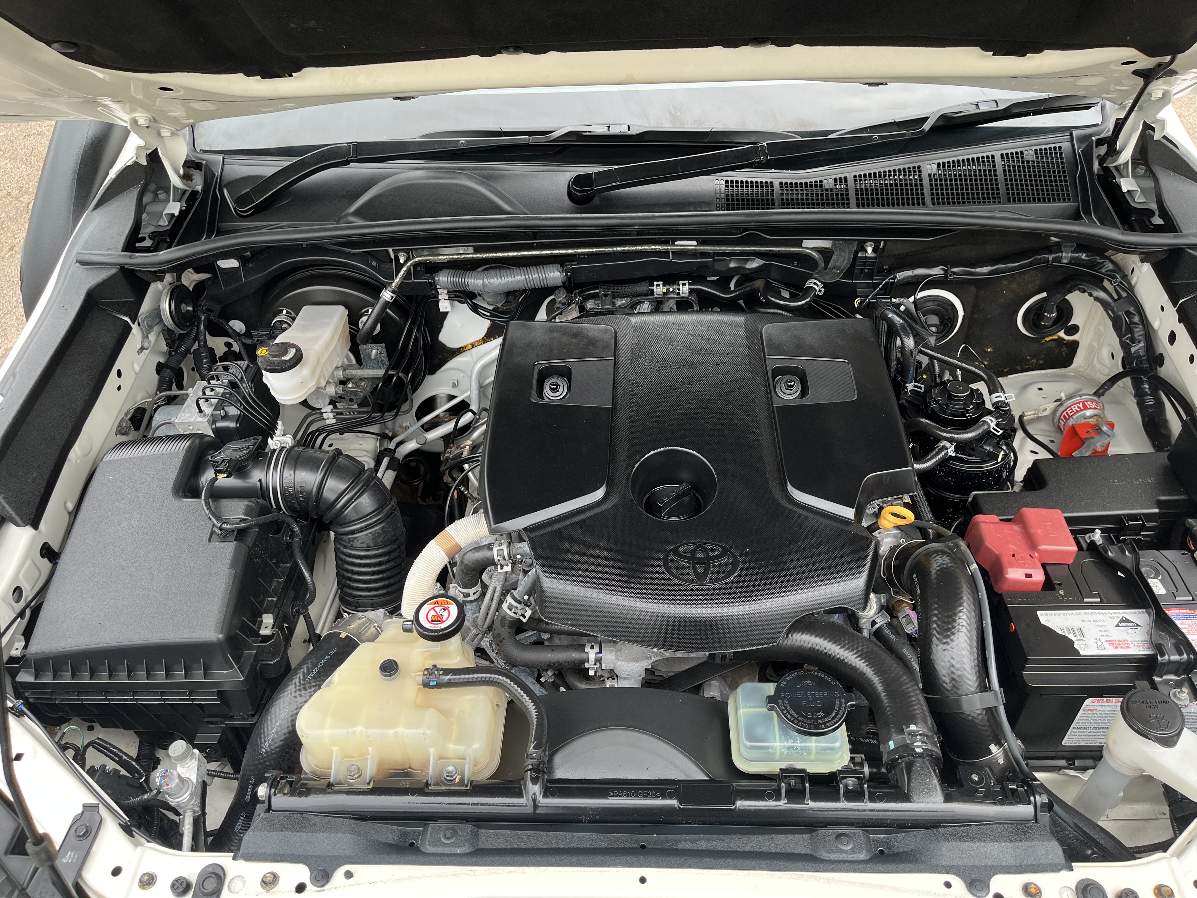 Professional engine bay detailing - clean restored engine bay